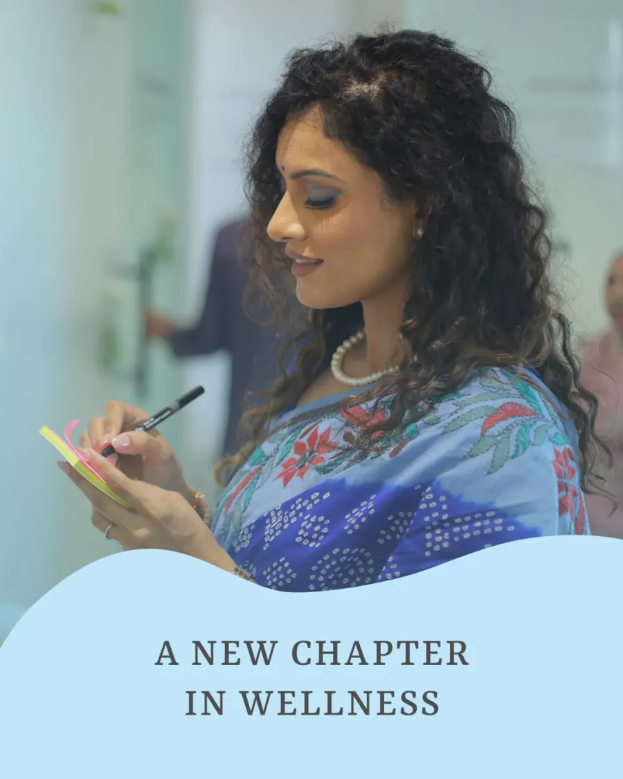 Dr. Twinkle Gohil writing a wellness note