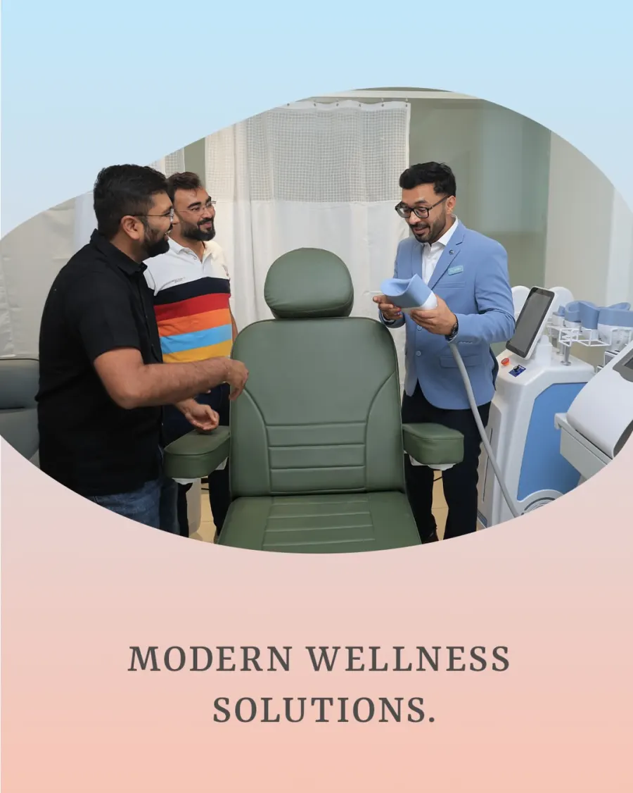Dr. Dhrumit Gohil shows guests a body contouring treatment chair